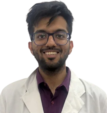 Dr. Aditya Vohra, psychiatrist, in a white coat